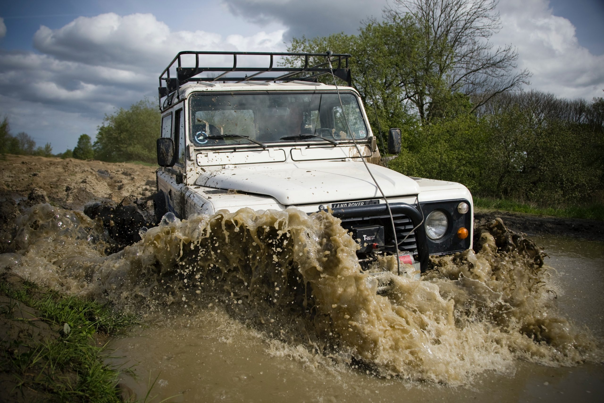 Australia's Best Touring Locations - offroad vehicle driving through water