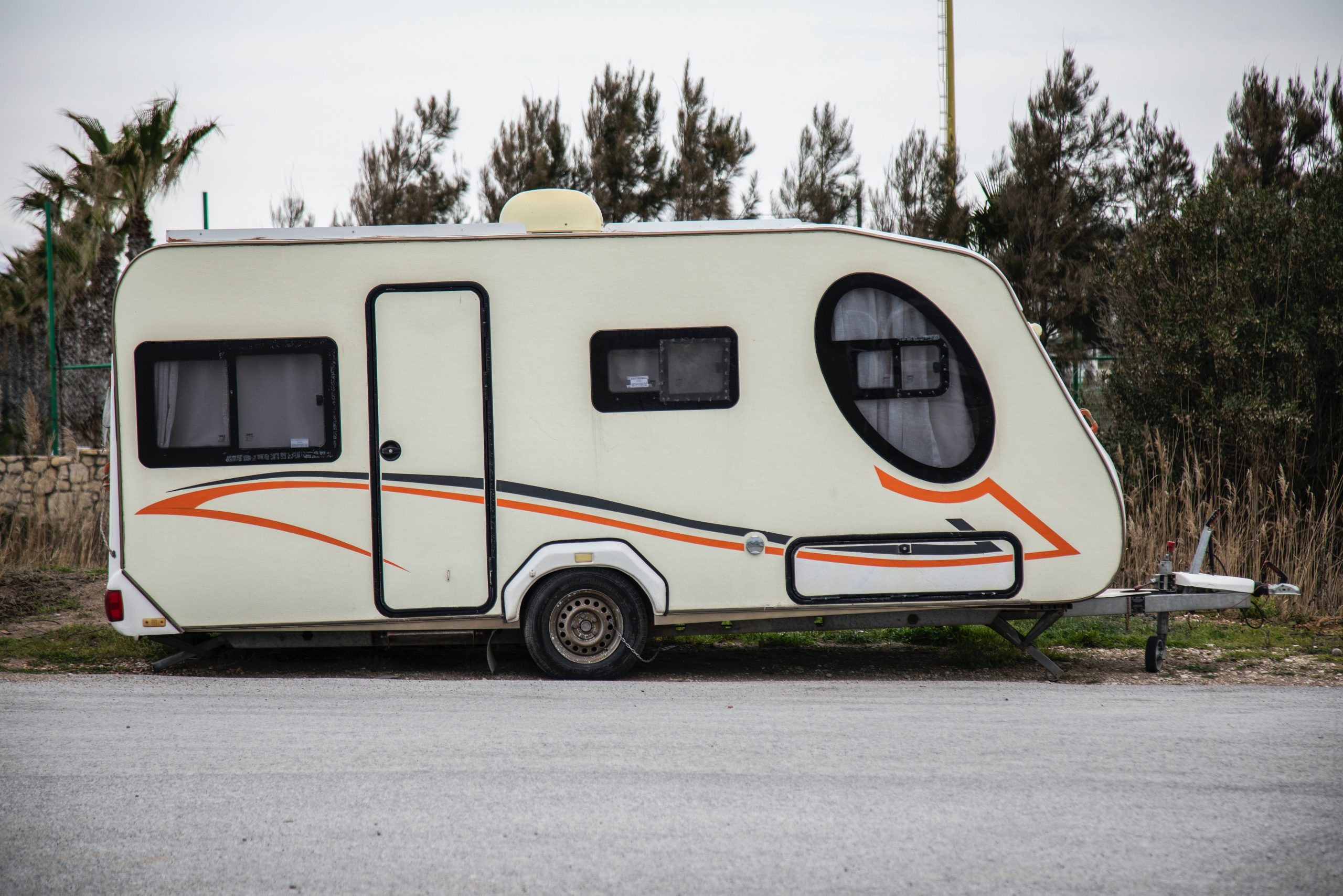 Towing A Trailer: Top Tips and Upgrade Opportunities - white caravan parked on side of the road