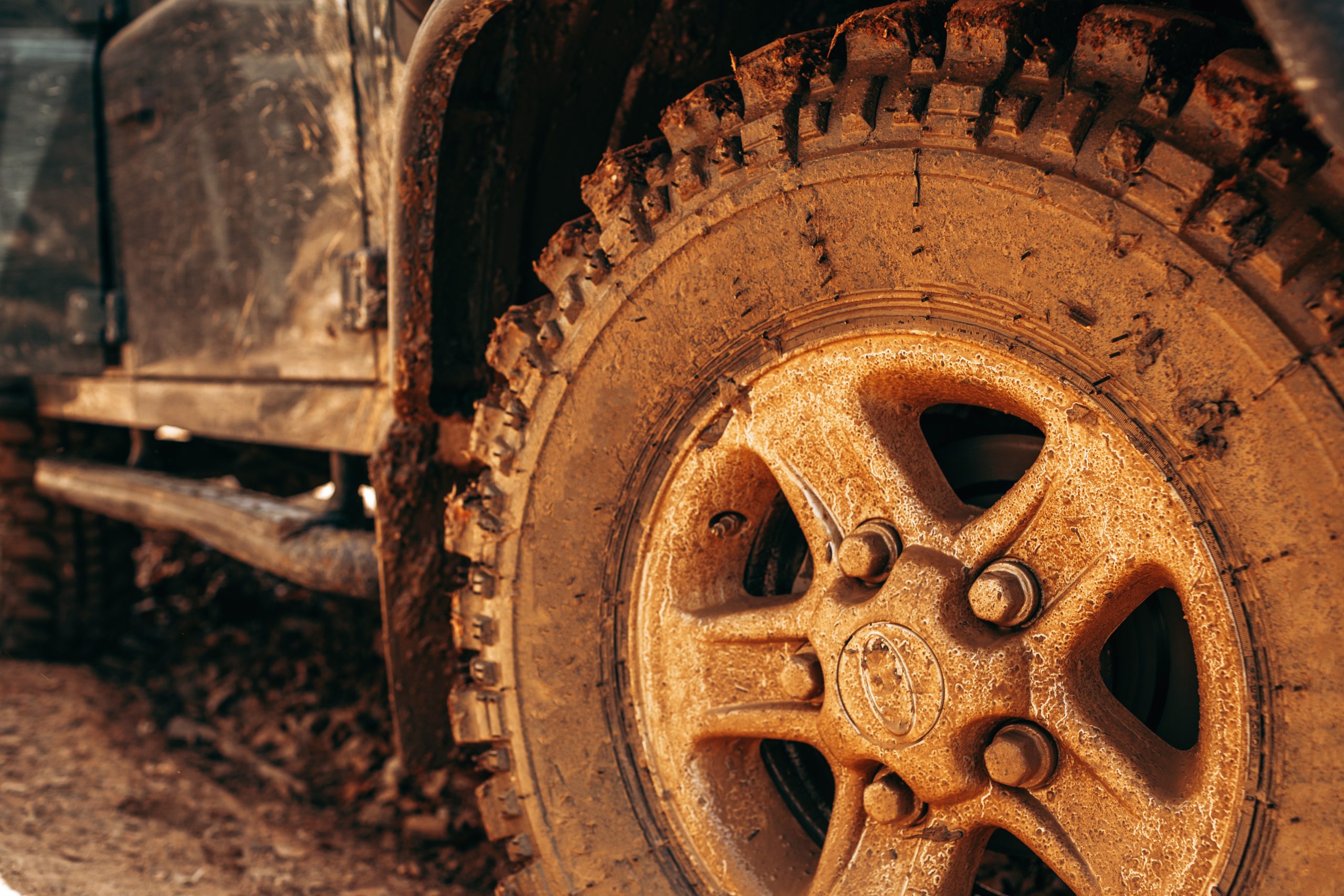 What is DPF in a Diesel Engine? - close up of muddy car tyre