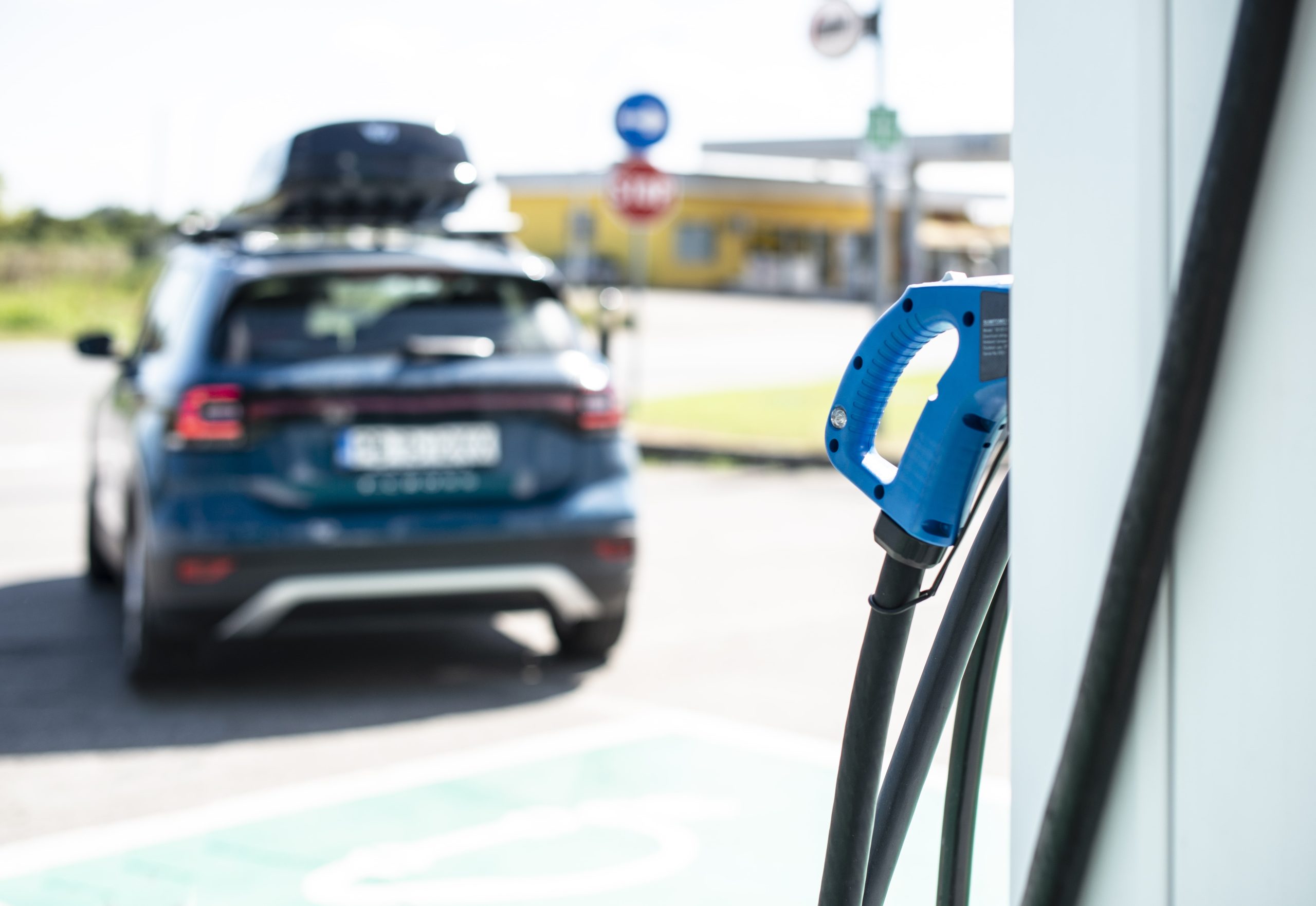 EVs VS Diesel: Are Electric Vehicles the End of Diesel Engines? - Electric vehicle in front of charging station