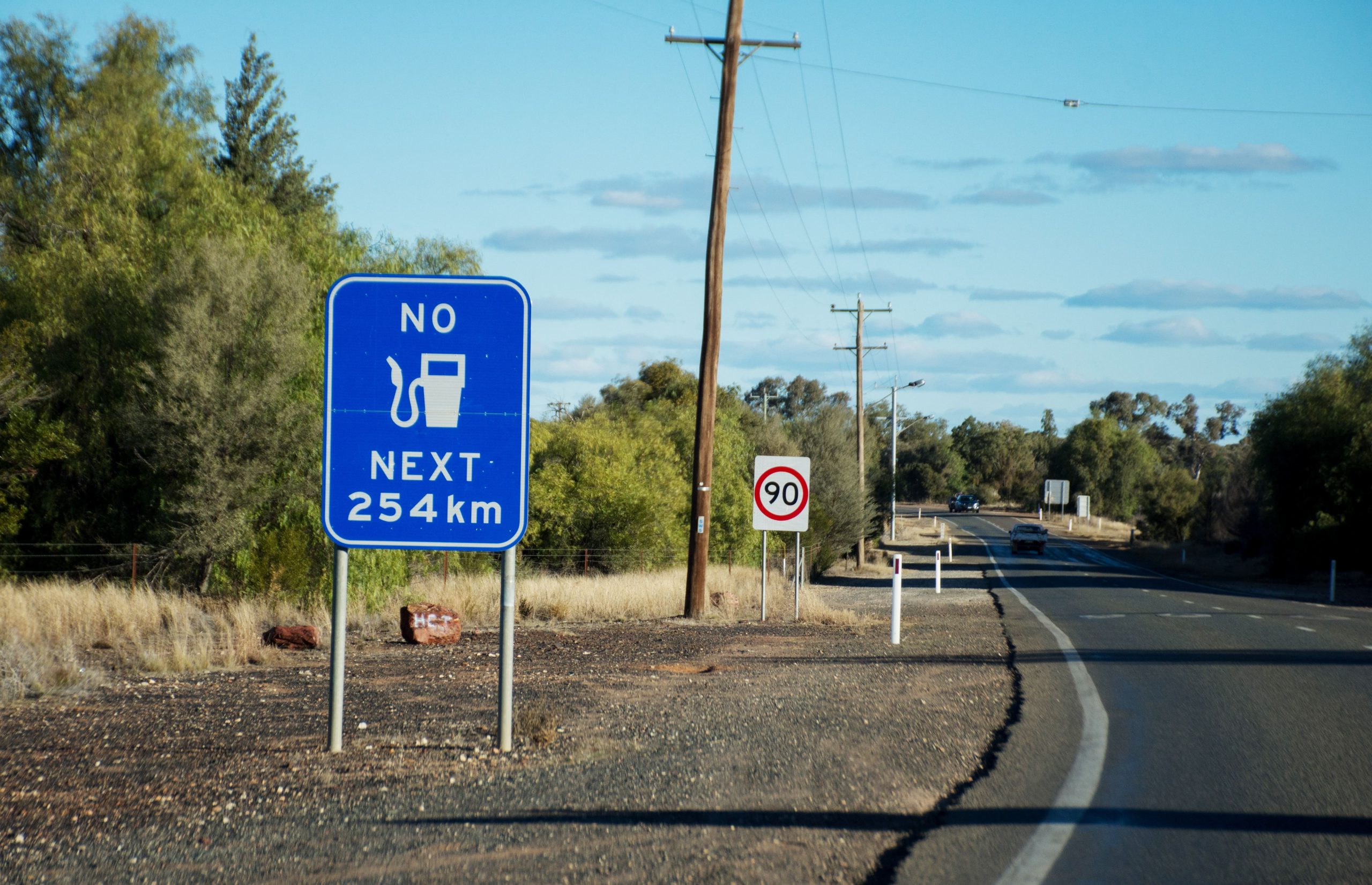 Maximise Your Mileage: Diesel Fuel Economy Tips - service station sign on road