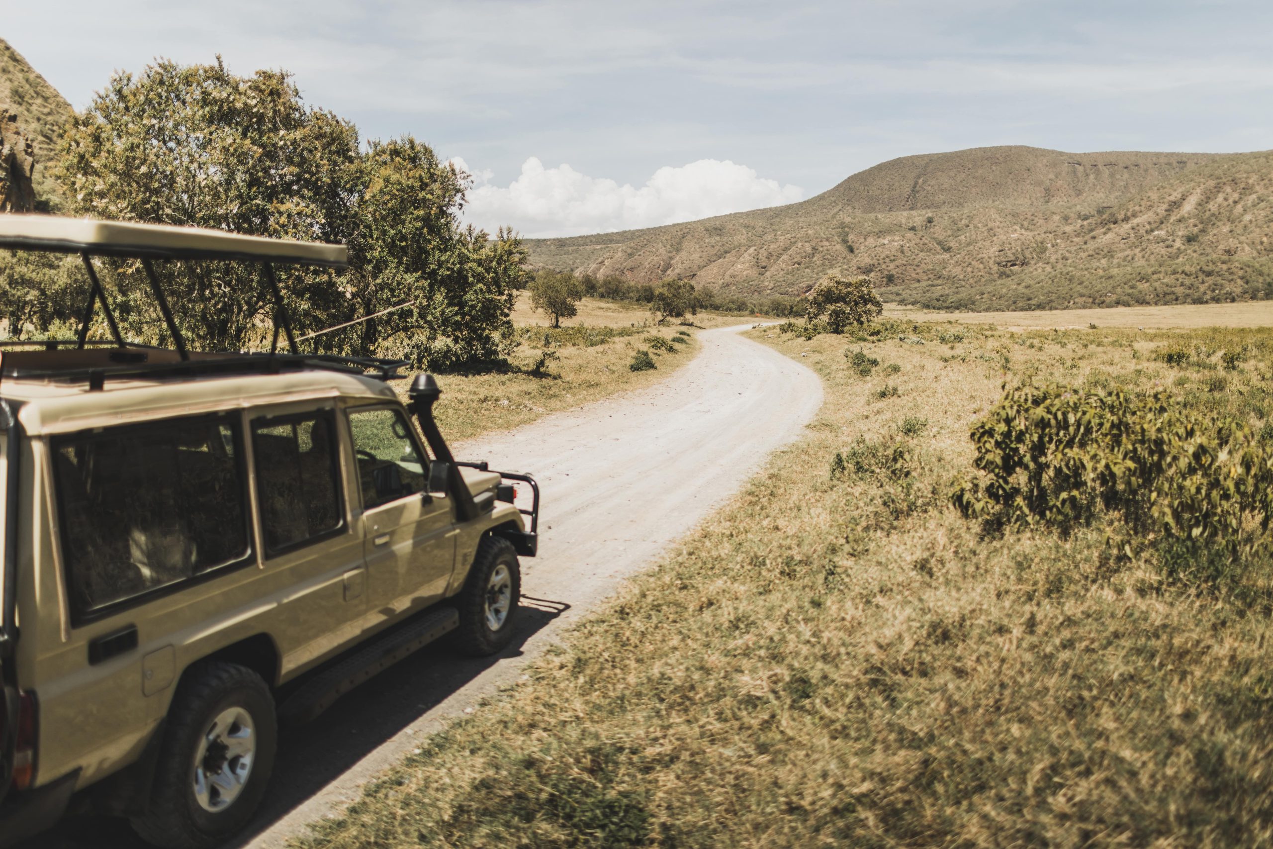 How to Bolster Diesel Engine Performance & Maintain Emissions Compliance - side view of 4x4 driving on dirt road