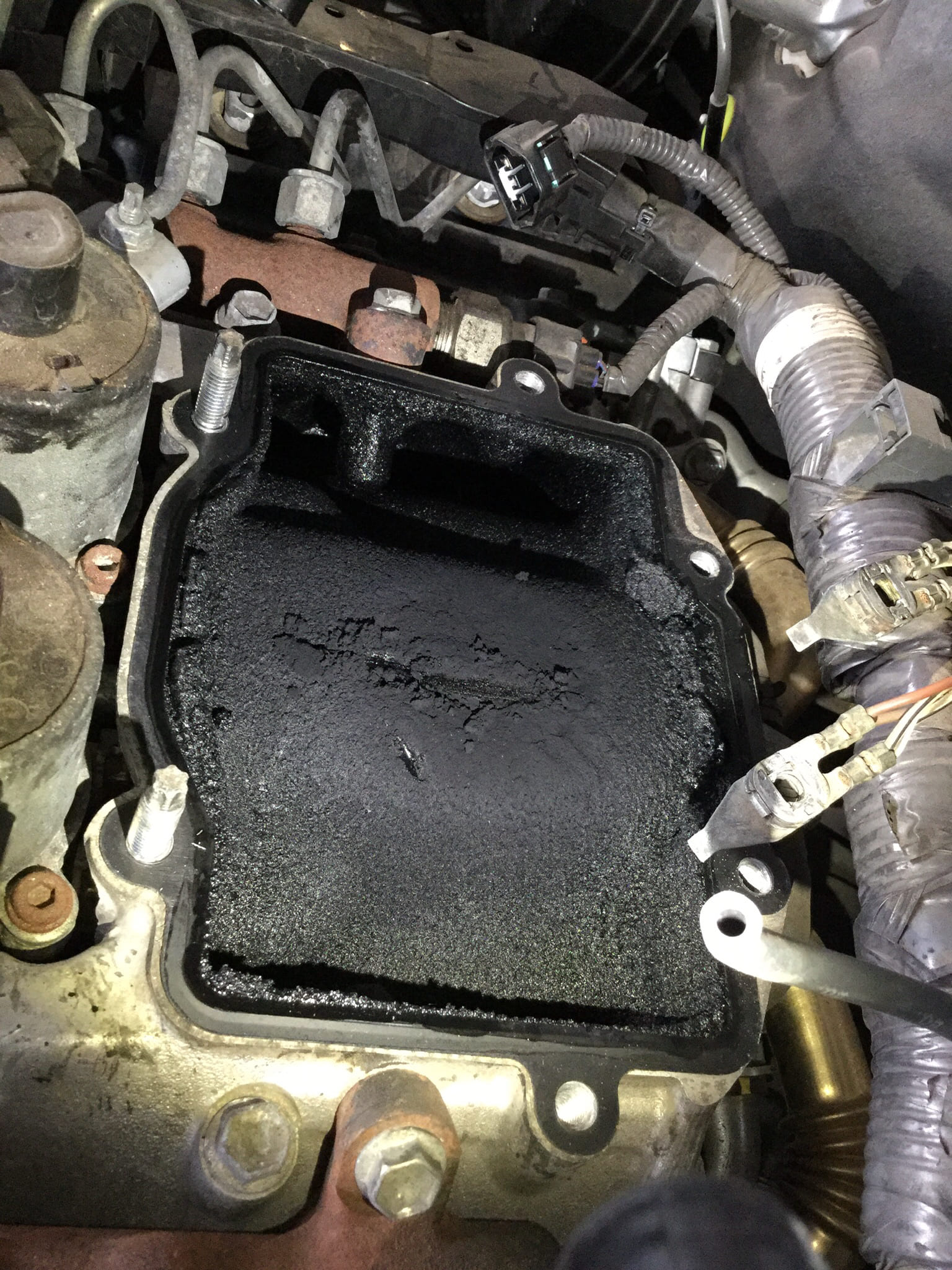 How to Prevent Carbon Build-up in Diesel Engines - close up of dirty intake inlet