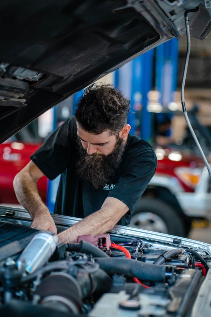 3 Benefits of Diesel Intake Manifold Cleaning - diesel performance technician working on Toyota at Just Autos