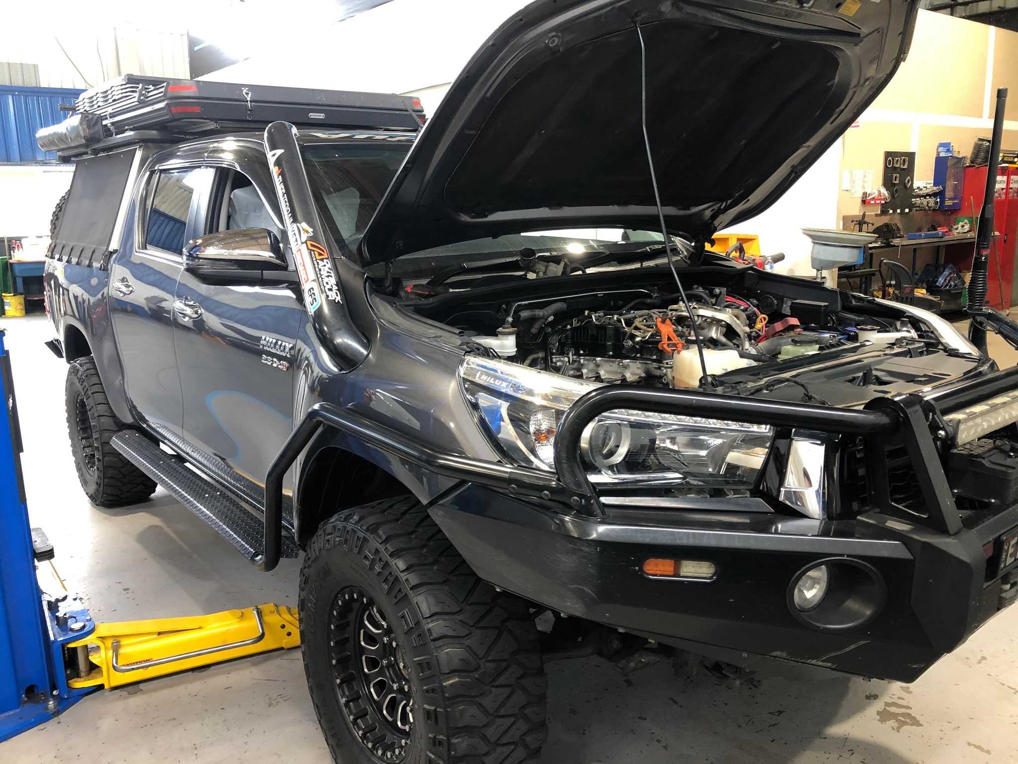 The Pros and Cons of a Diesel Engine Overhaul - Toyota Hilux with hood open showing engine