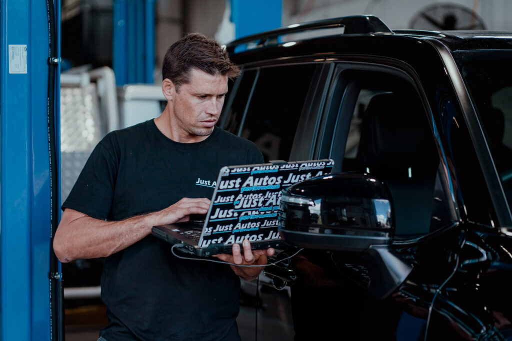 Just Autos owner and diesel mechanic Matt remapping the ECU of a Toyota diesel