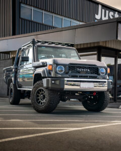 Silver Toyota 79 Series dual cab with canopy outside Just Autos