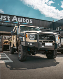 Sand Toyota 79 Series single cab with tray outside Just Autos
