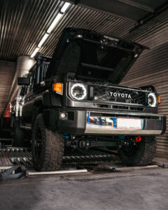 Dark grey Toyota 70 Series LandCruiser on dyno with hood open