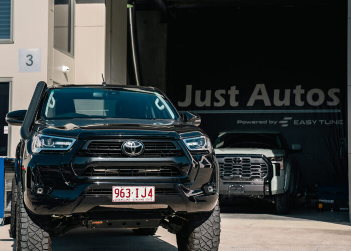 Black Toyota Hilux outside Just Autos powered by Easy Tune workshop